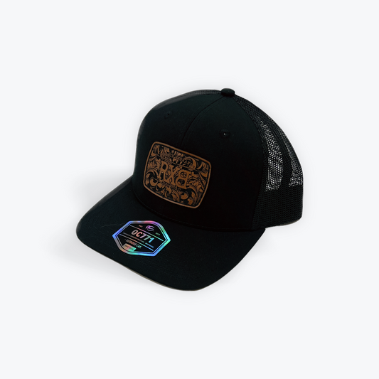 Black cap with a decorative patch 